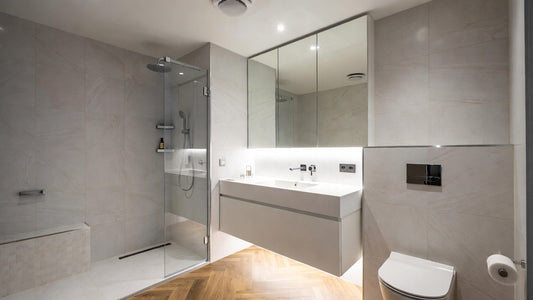 Luxury Bathroom Australia design featuring walk-in shower, wall-mounted vanity and neutral stone tiles